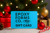 Epoxy Forms Co. gift card with Christmas decorations in the background. Perfect gift for epoxy lovers.